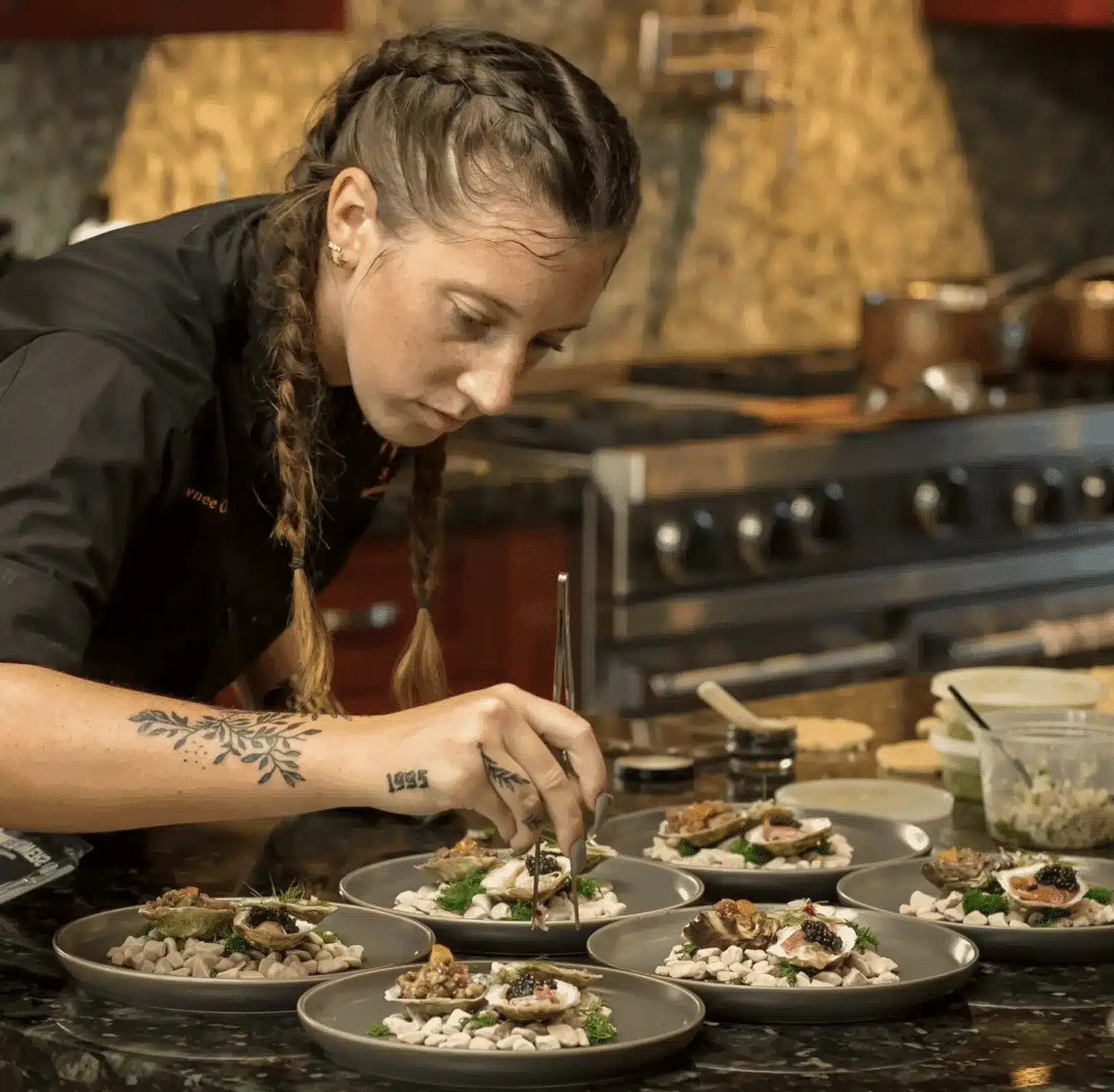 female-chef-gourmet-oyster-preparation.png
